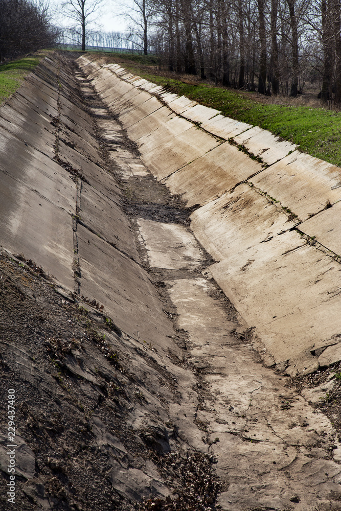 dry irrigation canal and water drainage system in zone of irrigated agriculture. Snow-white winter threatens a severe drought and crisis in agriculture. There is no harvest due to drought dry irrigation canal and water drainage system in zone of irrigated agriculture. Snow-white winter threatens a severe drought and crisis in agriculture. There is no harvest due to drought