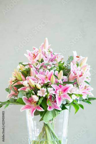 Fototapeta Naklejka Na Ścianę i Meble -  bouquet of lilies flowers on a gray background
