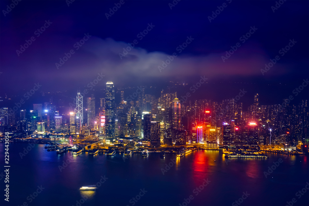 Aerial view of illuminated Hong Kong skyline. Hong Kong, China