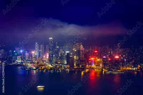 Aerial view of illuminated Hong Kong skyline. Hong Kong, China