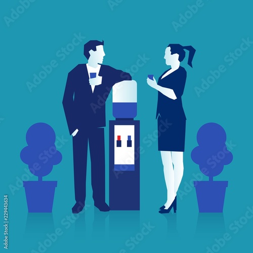 man and woman talking to each other near office water cooler.