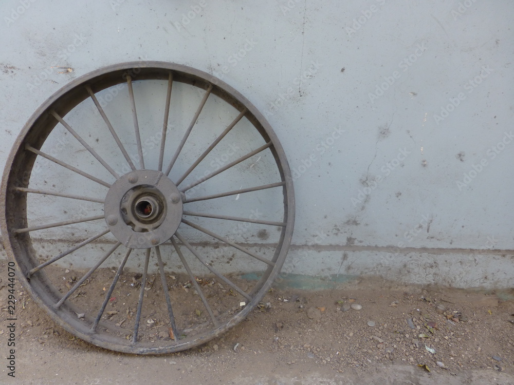 old wheel on a wall