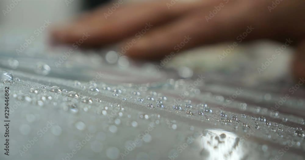 Drying of windows after car washing, drops flow down. Concept Drying