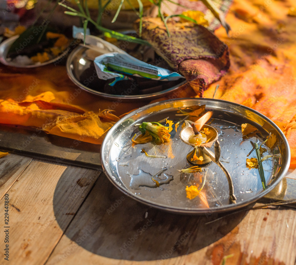 Plate with lit diya after the puja at Shri Ganesh. Plate with lit diya after the puja at Shri Ganesh.