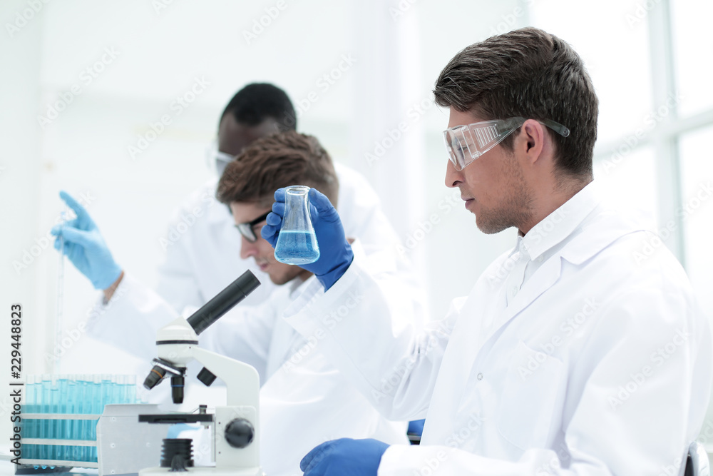 group of young scientists conduct laboratory studies group of young scientists conduct laboratory studies