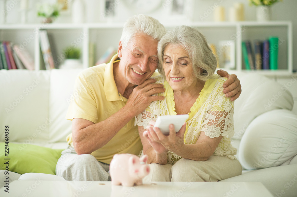 Portrait of a old woman with piggy bank Portrait of a old woman with piggy bank
