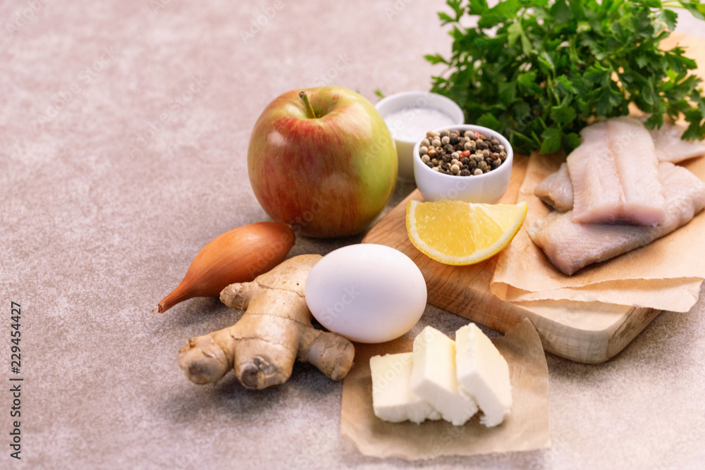 Ingredients for traditional jewish snack forshmak on wooden cutting board. Ingredients for traditional jewish snack forshmak on wooden cutting board.