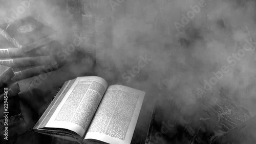 Haunted books - smoke / fog flowing across antique books