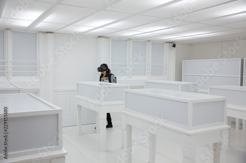 Woman using virtual reality head gear