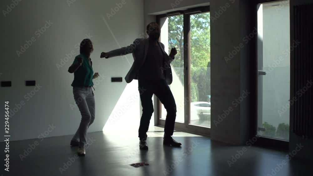 Happy couple dancing at their new home, super slow motion 240fps Happy couple dancing at their new home, super slow motion 240fps