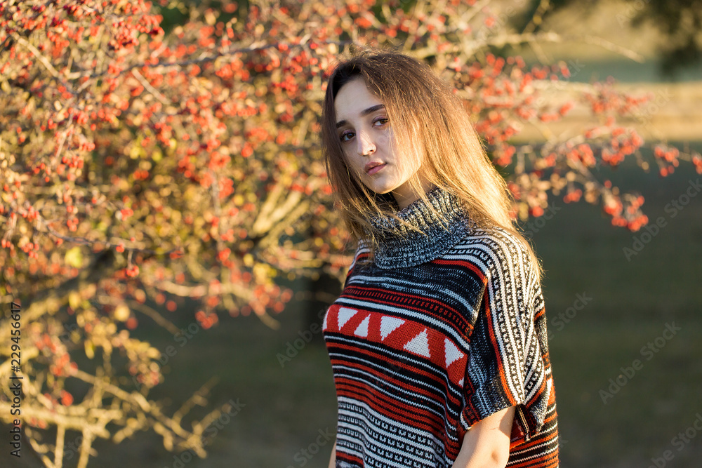 Autumn portrait of a girl in ethnic sweater Autumn portrait of a girl in ethnic sweater
