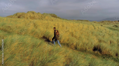 Wonderful hiking trails through the dunes of Irelands west coast © 4kclips