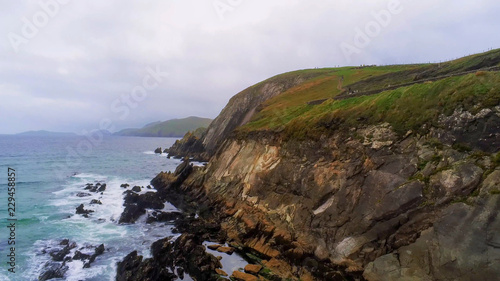 Flight along the steep cliffs at Dingle Peninsula in Ireland