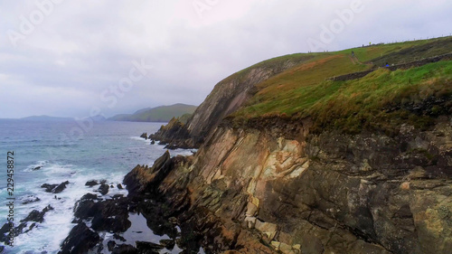 Flight along the steep cliffs at Dingle Peninsula in Ireland