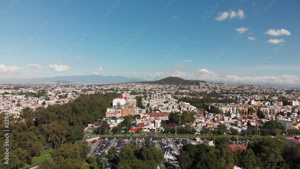 Aerial panoramic view in Mexico City, with views of Cerro de la Estrella on a very clear day with blue sky. Drone flying forward Aerial panoramic view in Mexico City, with views of Cerro de la Estrella on a very clear day with blue sky. Drone flying forward