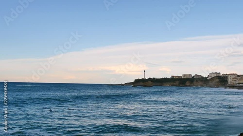 Wallpaper Mural Landscape of Biarritz, a city in southwestern France. View of the city lighthouse and surfers in the water. Filmed in October. Torontodigital.ca