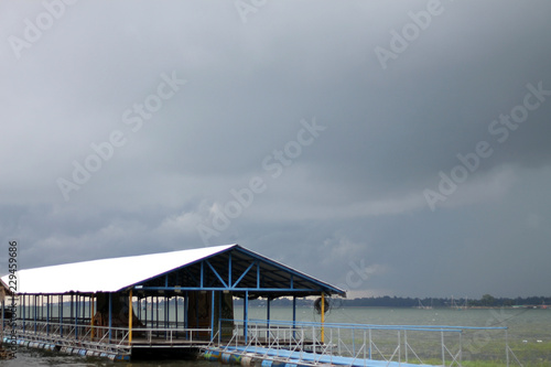 Wooden floating raft house in river at Sirintorn dam Ubonratchatani,Thailand. photo