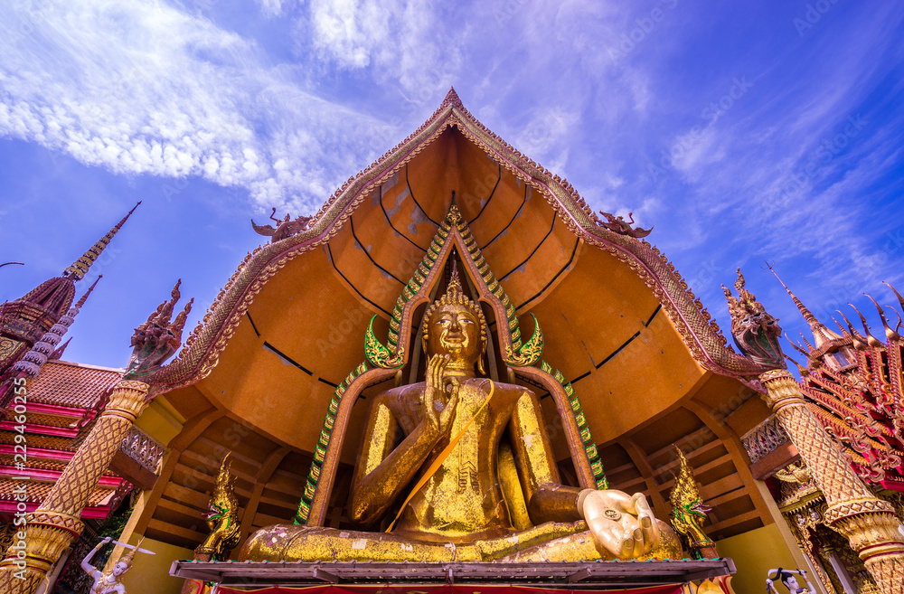 Big gold buddha statue and blue sky