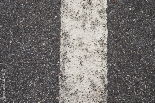 ASPHALT TEXTURE WITH WHITE SEPARATION LINE / TOP VIEW / FOR BACKGROUND