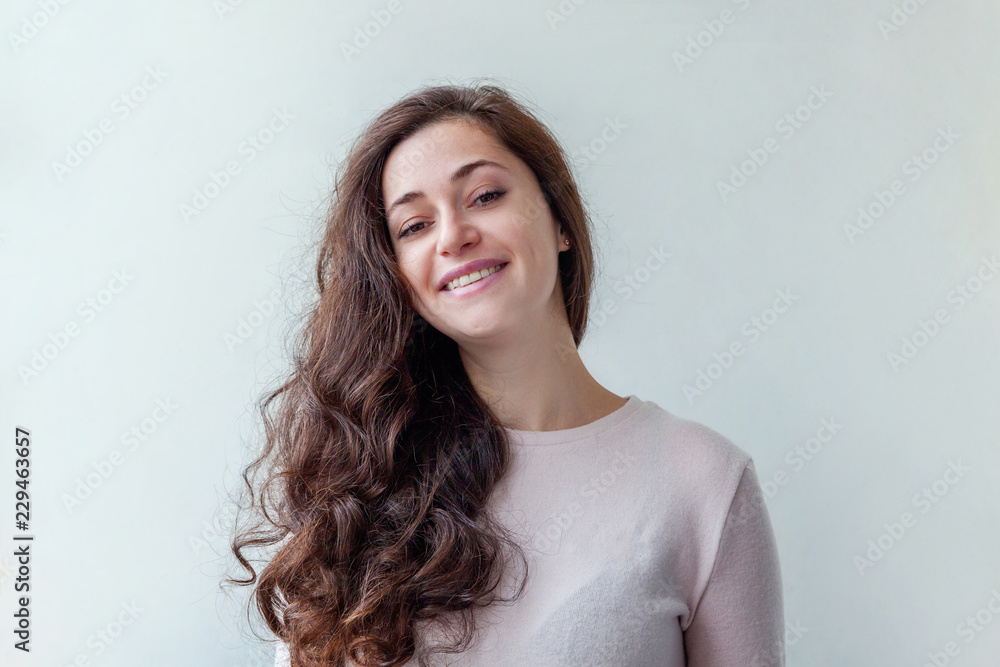 Happy girl smiling. Beauty portrait young happy positive laughing brunette woman on white background isolated. European woman. Positive human emotion facial expression body language Happy girl smiling. Beauty portrait young happy positive laughing brunette woman on white background isolated. European woman. Positive human emotion facial expression body language