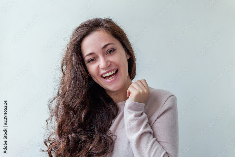 Happy girl smiling. Beauty portrait young happy positive laughing brunette woman on white background isolated. European woman. Positive human emotion facial expression body language Happy girl smiling. Beauty portrait young happy positive laughing brunette woman on white background isolated. European woman. Positive human emotion facial expression body language