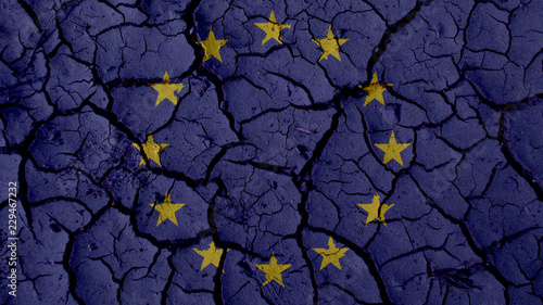Political Crisis Or Environmental Concept: Mud Cracks With EU Flag