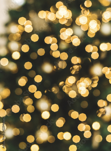 Christmas tree background with blurred, sparking, glowing. Happy New Year and Xmas theme. © Jukov studio