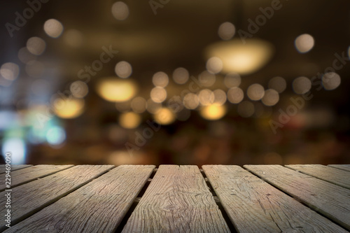 WOODEN TABLE WITH BACKGROUND OF BLURRED AND BOKEH OF LIGHTS AND CHANDELIERS IN LUXURY SUSHI BAR, JAPAN (FOR ADD TEXT, MESSAGE, MERCHANDISES)