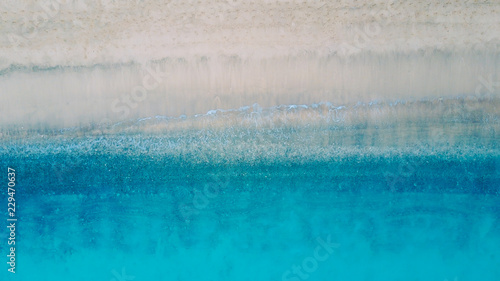 Top view of beautiful beach. Aerial drone shot of turquoise sea water at the beach