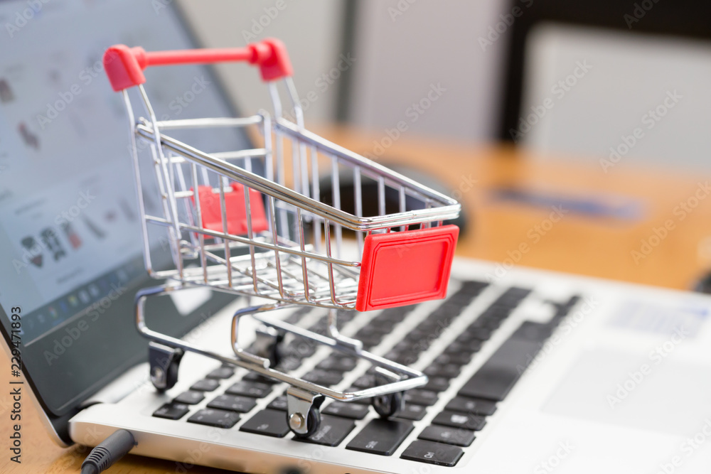 Cart and laptop for shopping online concept