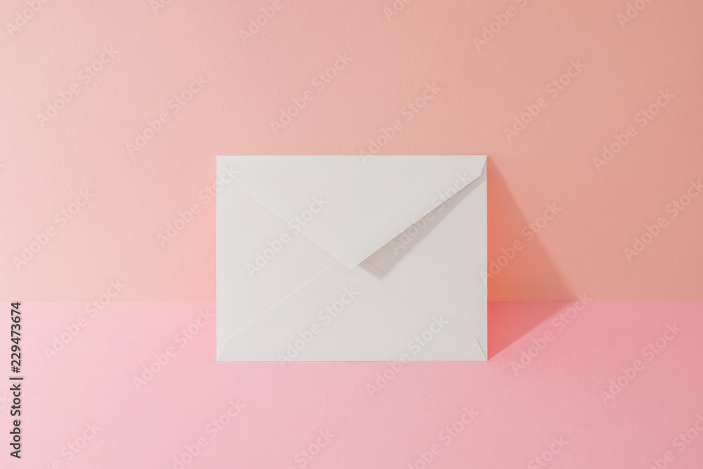 a white envelope, Pink Two Tone Background a white envelope, Pink Two Tone Background