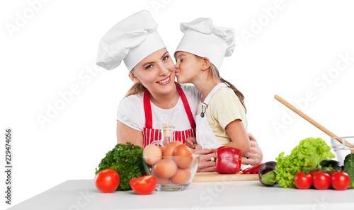mother and daughter prepare salads