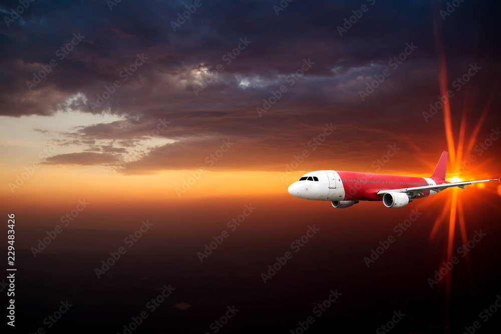 Airplane in the sky at sunrise Airplane in the sky at sunrise