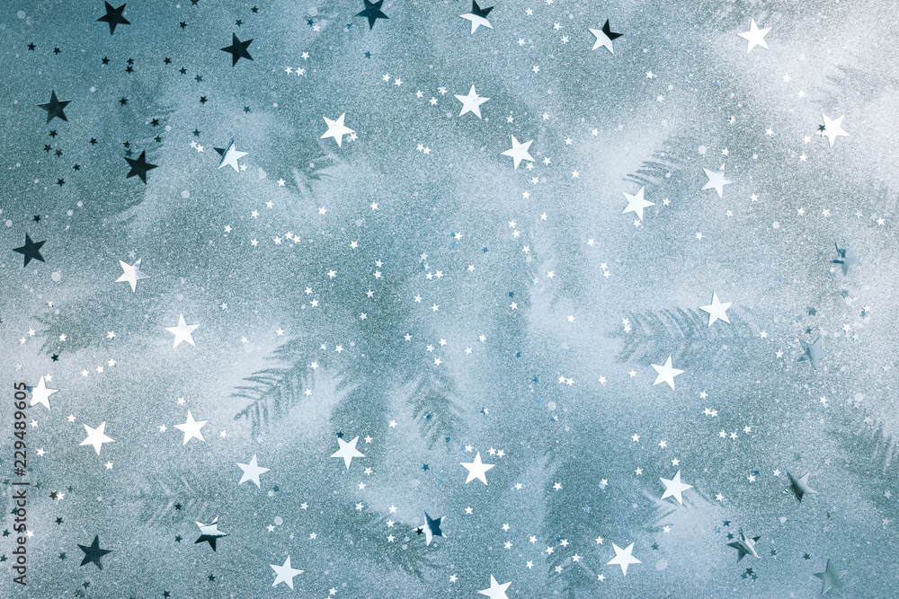 festive christmas background with fir tree branches imprints and silver confetti festive christmas background with fir tree branches imprints and silver confetti