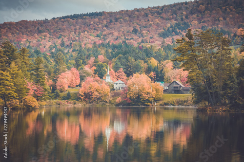Long Lake, Adirondacks, NY, in the fall surrounded by brilliant colorful foliage