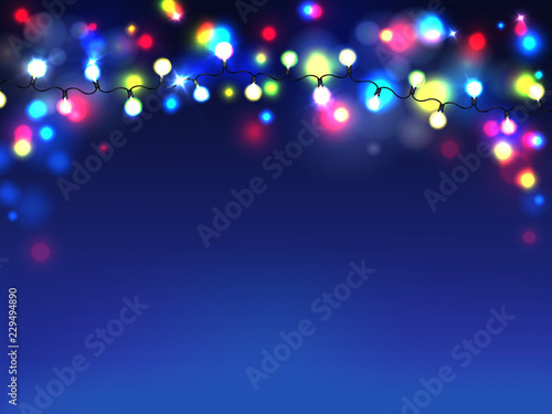 Vector bright garlands isolated on blue background. Diffuse lights of electric bulbs on black cords. Glowing elements of festive decoration. Christmas celebration with luminous lamps, illumination.