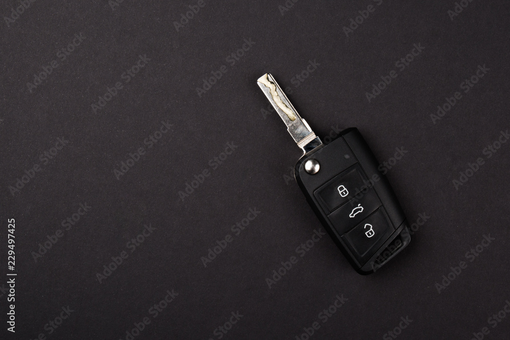 Cars Key, with three electronic remote button. isolated on black background. Copy Space Cars Key, with three electronic remote button. isolated on black background. Copy Space
