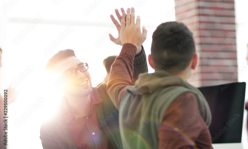 Fototapeta premium business colleagues giving each other high five