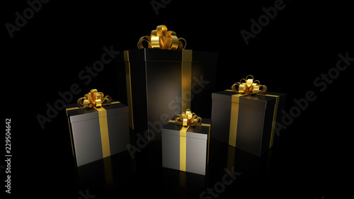 black gift boxs with golden ribbon bow on the dark background