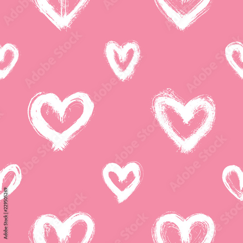 Seamless pattern with white hand-drawn uneven hearts isolated on pink background. Ink doodle style abstract grunge texture.