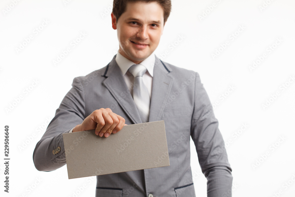Businessman showing signboard with copyspase, on white Businessman showing signboard with copyspase, on white