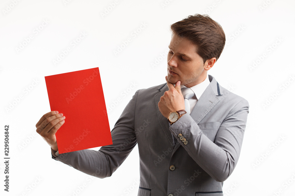 Businessman showing signboard. In studio on a white background Businessman showing signboard. In studio on a white background