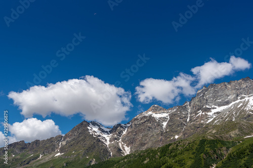 Mountain peaks and sky in Alps, Italy.