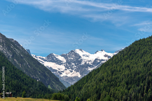 Mountain peaks and sky in Alps, Italy. © Janis Smits