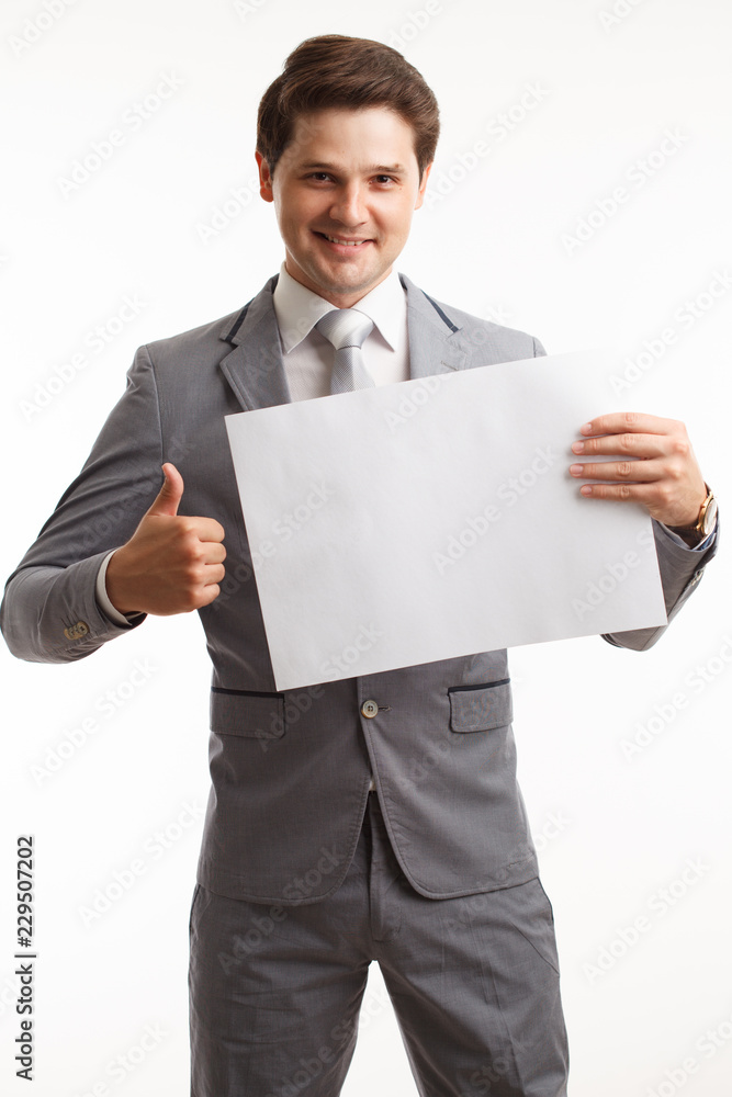 Businessman showing signboard. In studio on a white background Businessman showing signboard. In studio on a white background