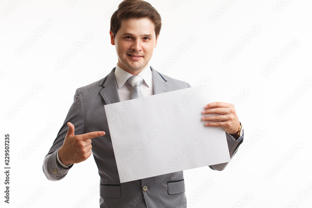 Businessman showing signboard. In studio on a white background Businessman showing signboard. In studio on a white background
