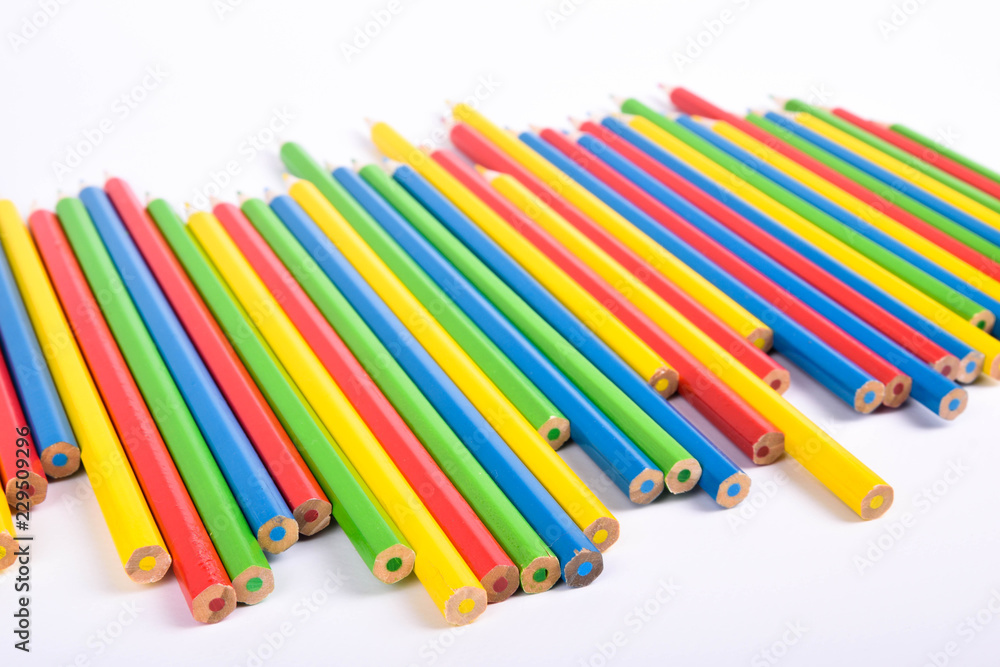 Many different colored pencils on a white background with a place for text and cory space . Many different colored pencils on a white background with a place for text and cory space .