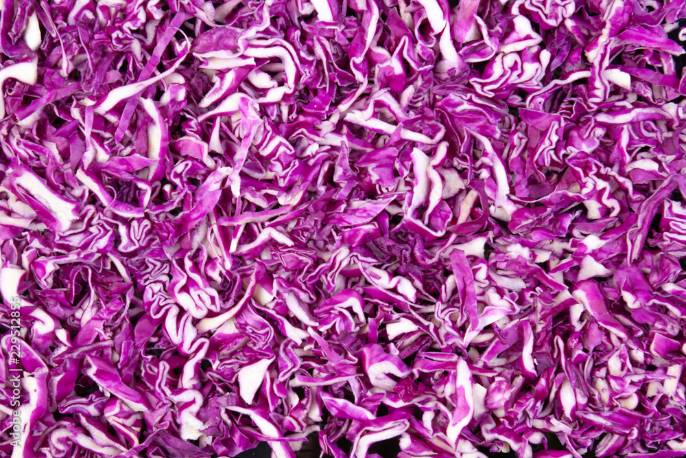 Fototapeta premium Shredded red cabbage textured top view
