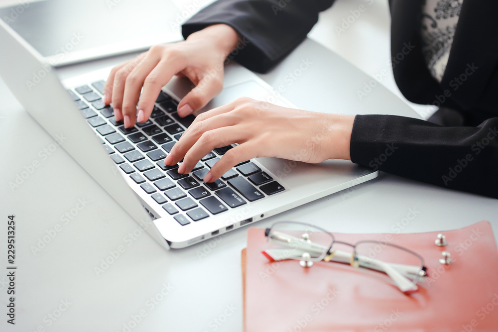 businesswoman hands with glasses using computer businesswoman hands with glasses using computer