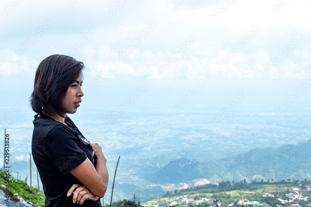Women are watching the fog on the mountain. Women are watching the fog on the mountain.
